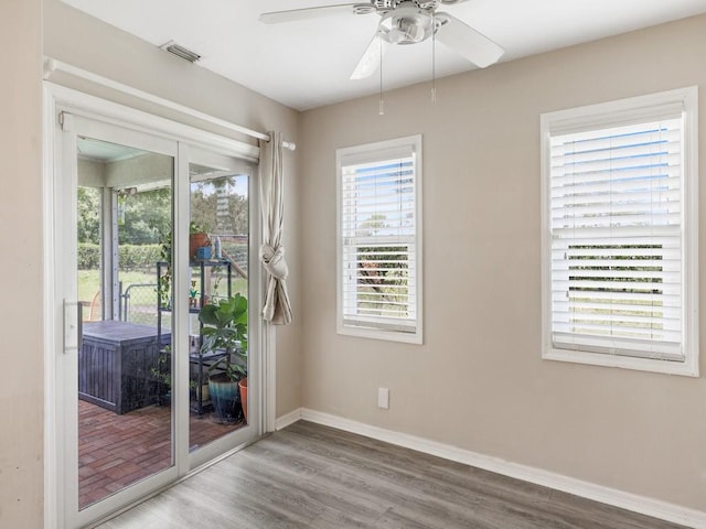 empty room featuring hardwood / wood-style floors and ceiling fan