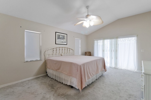 carpeted bedroom with ceiling fan and lofted ceiling