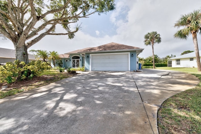 single story home featuring a garage