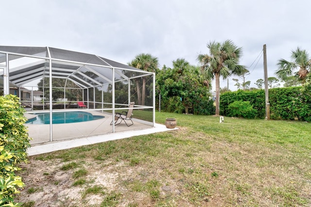 view of yard featuring a lanai and a patio area