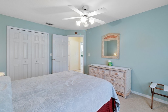 carpeted bedroom with a closet and ceiling fan