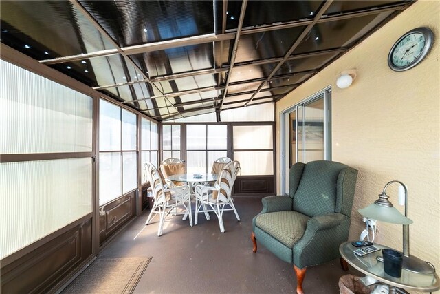 sunroom / solarium featuring outdoor dining area