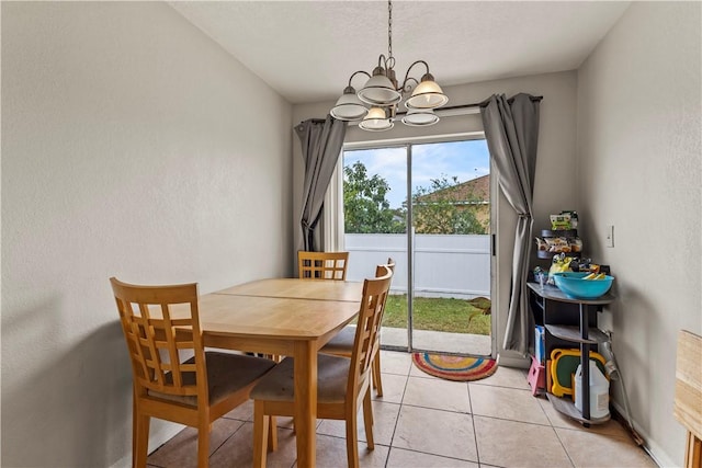 dining room with an inviting chandelier and light tile patterned flooring