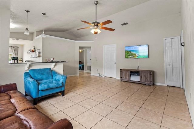 living room featuring lofted ceiling, light tile patterned floors, and ceiling fan