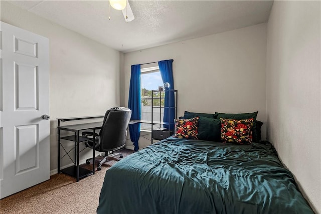 bedroom featuring a textured ceiling and ceiling fan