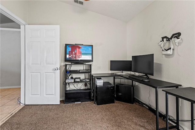 office space with lofted ceiling and tile patterned floors