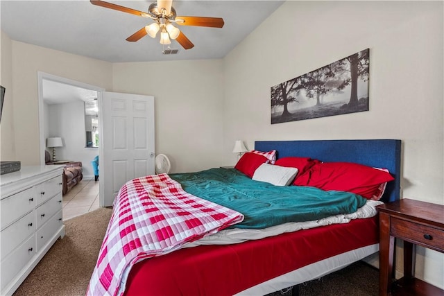 bedroom with light carpet and ceiling fan