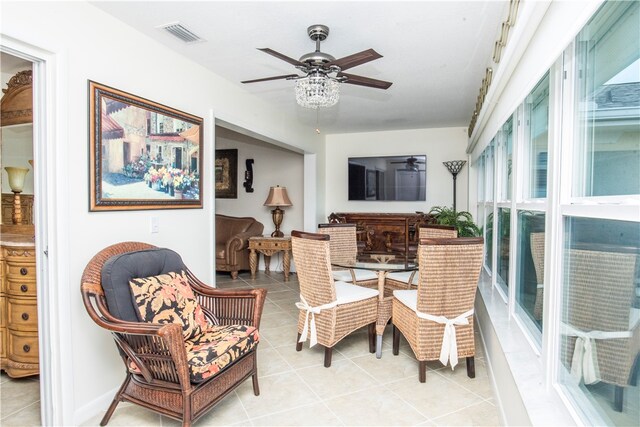 dining space with ceiling fan and light tile patterned floors