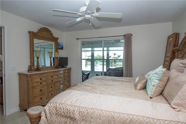 bedroom featuring access to exterior, ceiling fan, and light tile patterned flooring