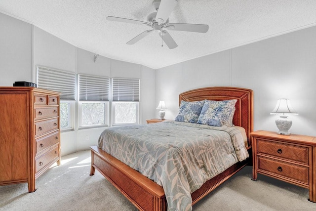 carpeted bedroom with ceiling fan, a textured ceiling, and vaulted ceiling