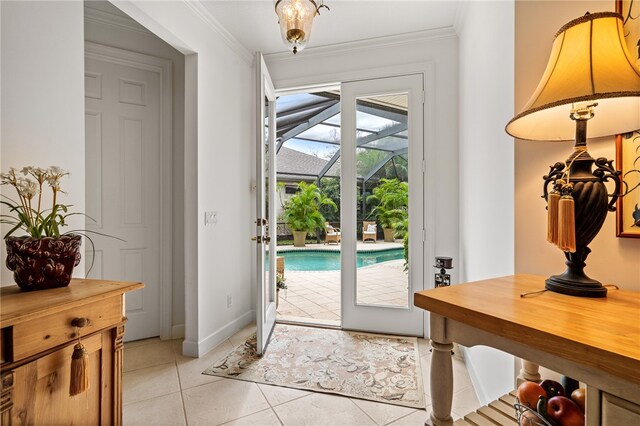 doorway with light tile patterned floors and ornamental molding