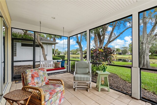 sunroom with a water view