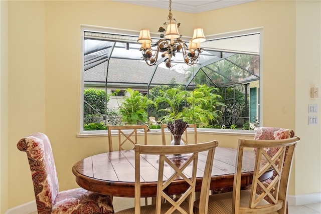 dining area with an inviting chandelier and ornamental molding