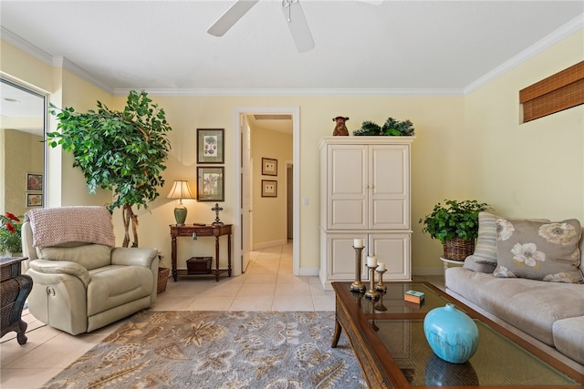 living room featuring ornamental molding, light tile patterned floors, and ceiling fan