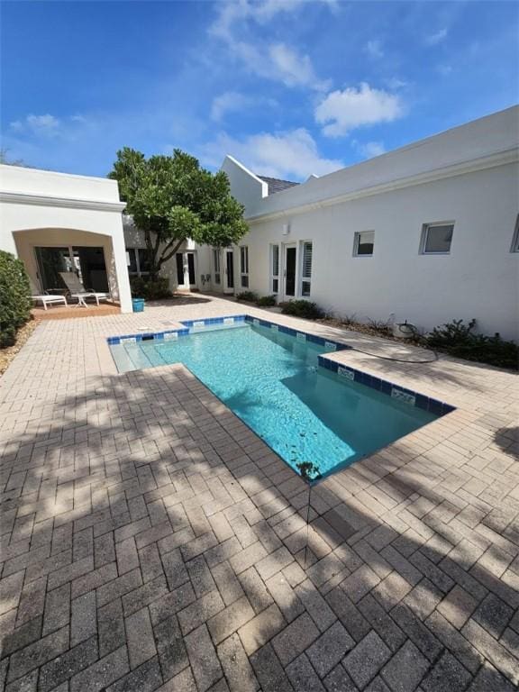 pool featuring a patio area