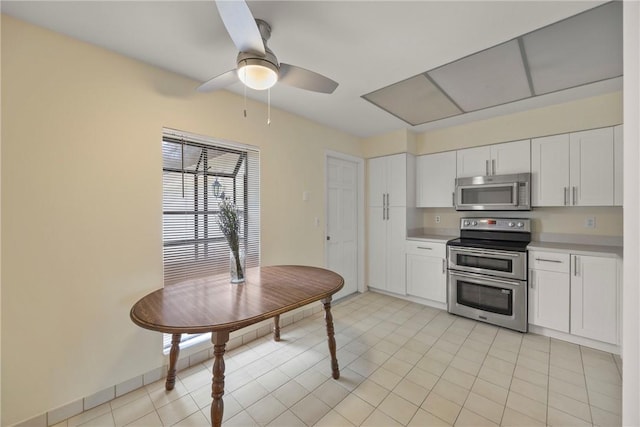 2821 21st Pl, Vero Beach, FL 32960 - kitchen featuring appliances with stainless steel finishes, white cabinetry, light countertops, and a ceiling fan