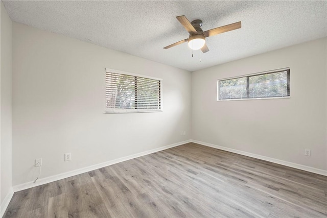 2821 21st Pl, Vero Beach, FL 32960 - empty room featuring wood finished floors, ceiling fan, a textured ceiling, and baseboards
