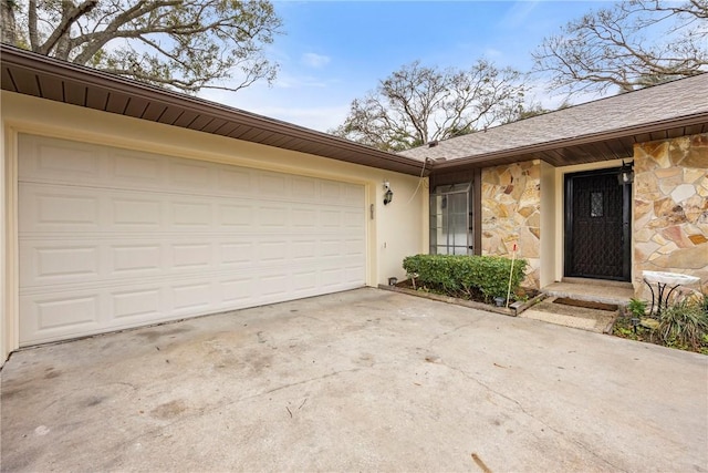 2821 21st Pl, Vero Beach, FL 32960 - entrance to property with stone siding, driveway, a garage, and a shingled roof