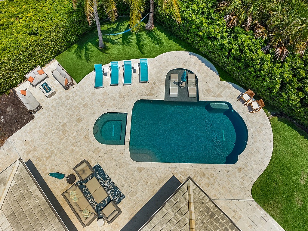 view of swimming pool with a lawn and a patio