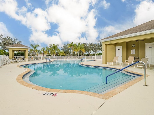 view of swimming pool featuring a patio area