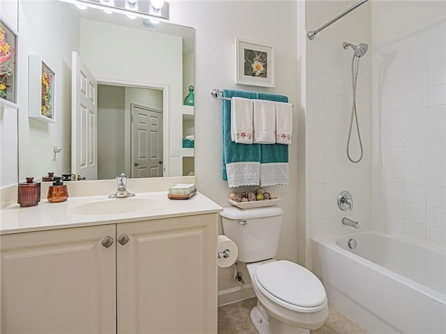 full bathroom with vanity, tiled shower / bath, and toilet