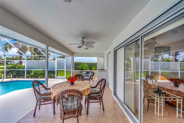 sunroom / solarium with ceiling fan