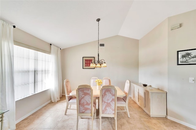 dining area with light tile patterned floors, a chandelier, and lofted ceiling