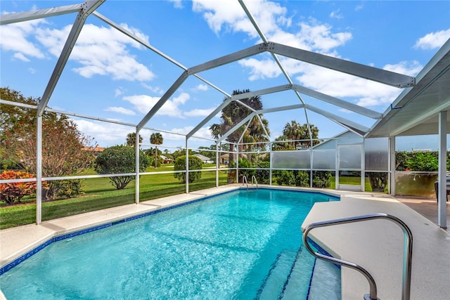 view of swimming pool featuring glass enclosure and a patio area