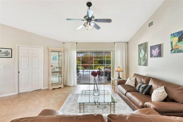 tiled living room with ceiling fan and lofted ceiling