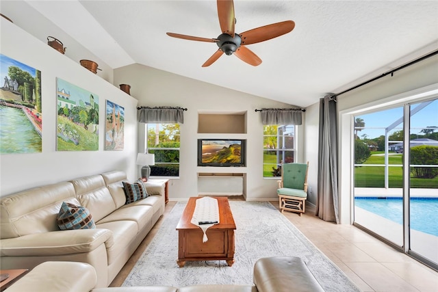 sunroom with ceiling fan and vaulted ceiling