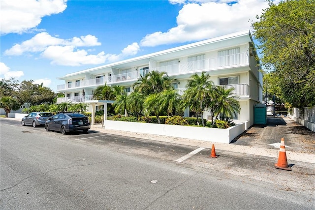 view of property featuring uncovered parking