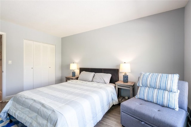 bedroom featuring a closet and wood finished floors