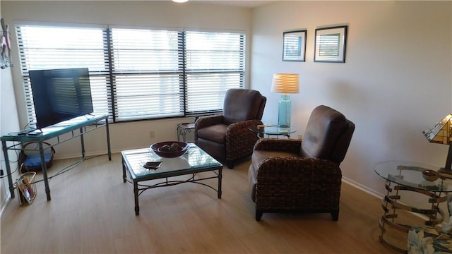 living area with a healthy amount of sunlight and light wood-type flooring