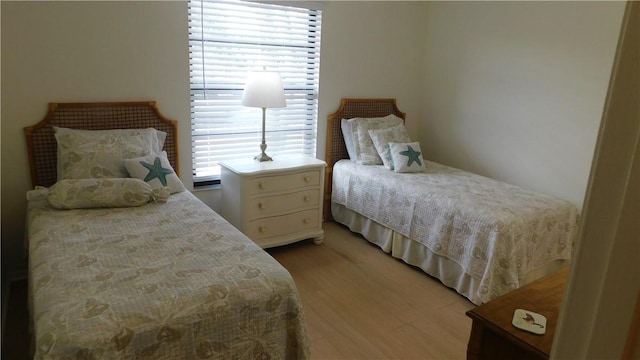 bedroom with light hardwood / wood-style floors