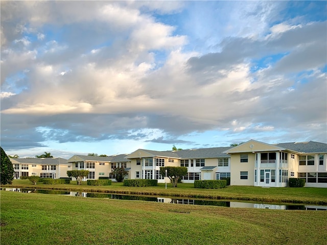 view of building exterior with a water view