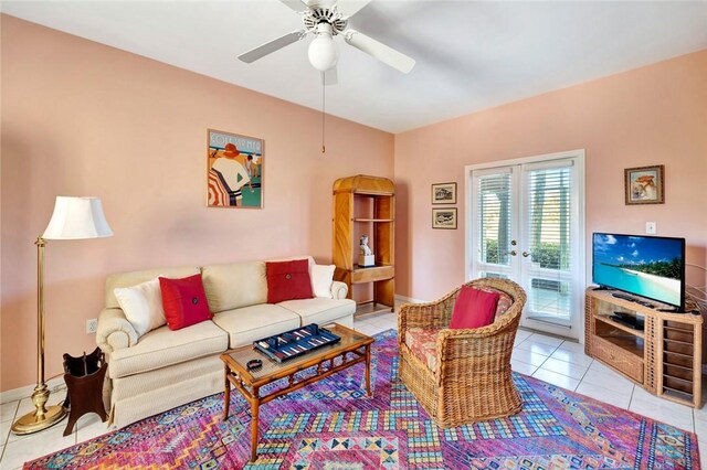 living room with light tile patterned floors, french doors, and ceiling fan