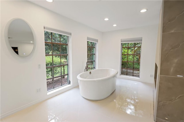 6235 4th St, Vero Beach, FL 32968 - bathroom featuring recessed lighting and a soaking tub