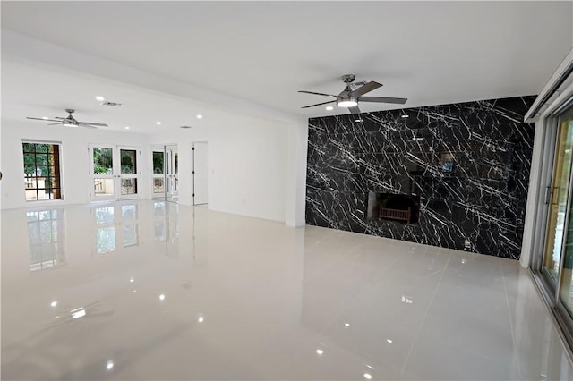 6235 4th St, Vero Beach, FL 32968 - unfurnished room featuring ceiling fan, tile walls, an accent wall, and recessed lighting