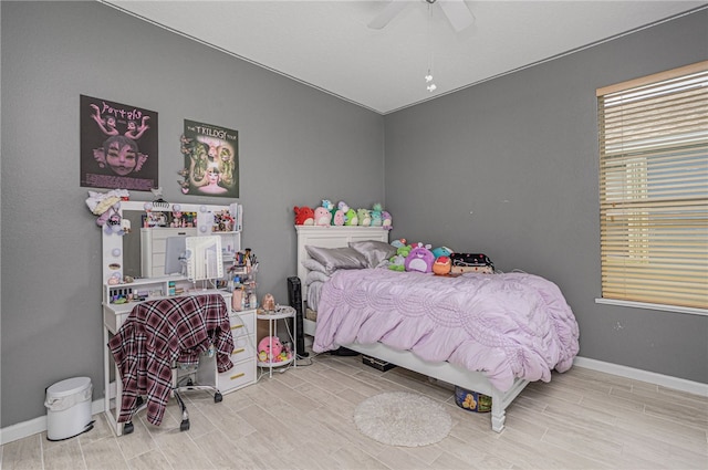 bedroom with hardwood / wood-style flooring and ceiling fan