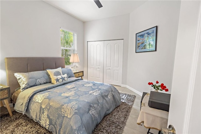 bedroom with ceiling fan and a closet