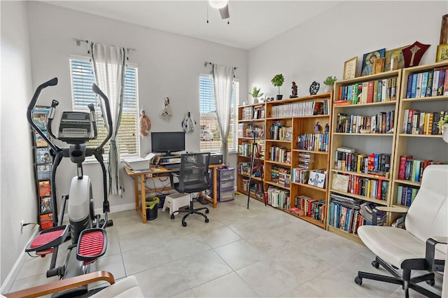 tiled office with ceiling fan and a healthy amount of sunlight