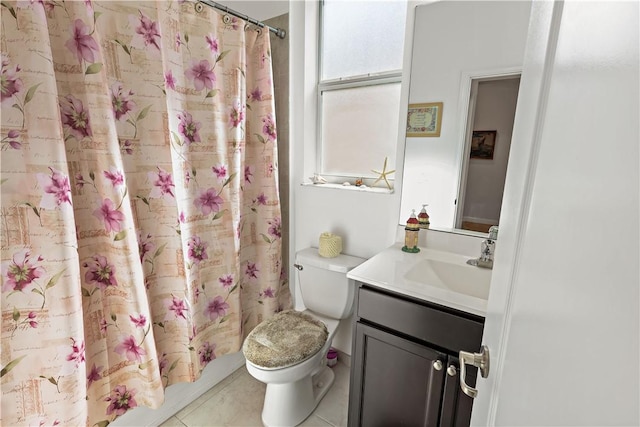 bathroom featuring tile patterned floors, vanity, and toilet