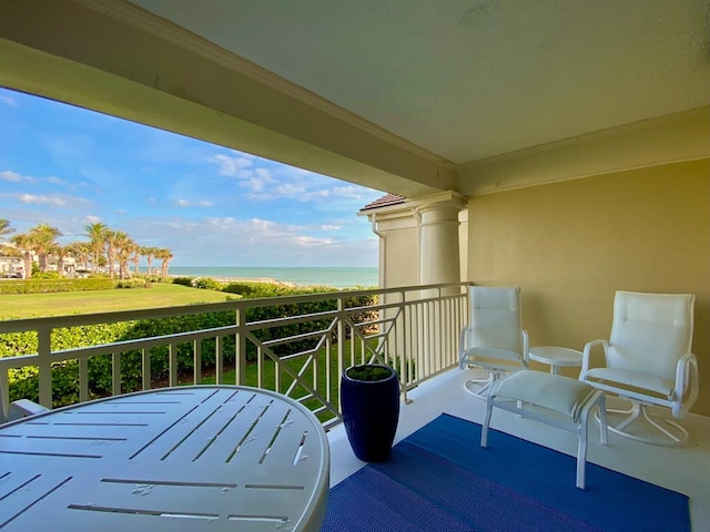 balcony featuring a water view