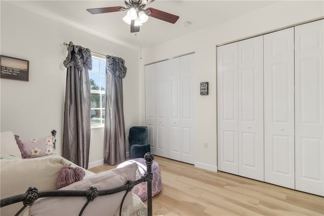 living area featuring ceiling fan and light hardwood / wood-style flooring