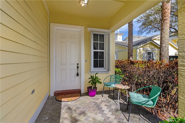 entrance to property with a patio