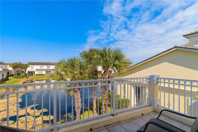 balcony featuring a water view