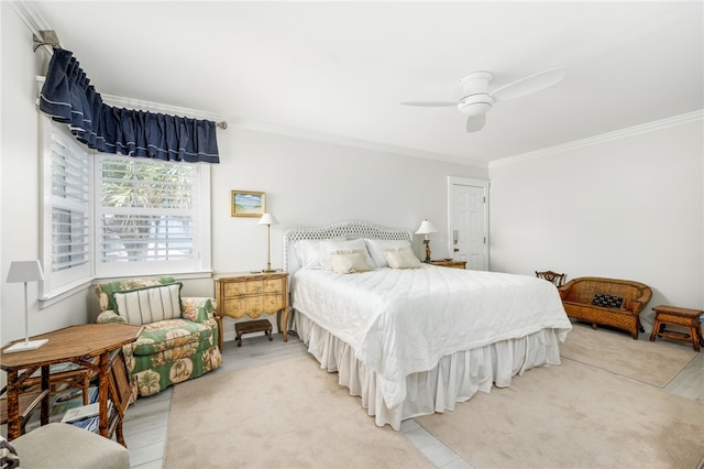 bedroom featuring ceiling fan and crown molding