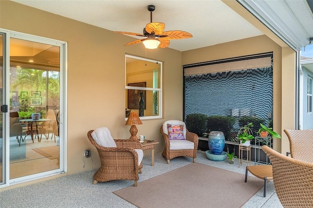 exterior space with ceiling fan