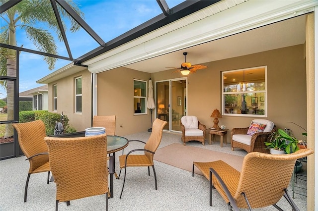 sunroom / solarium with ceiling fan