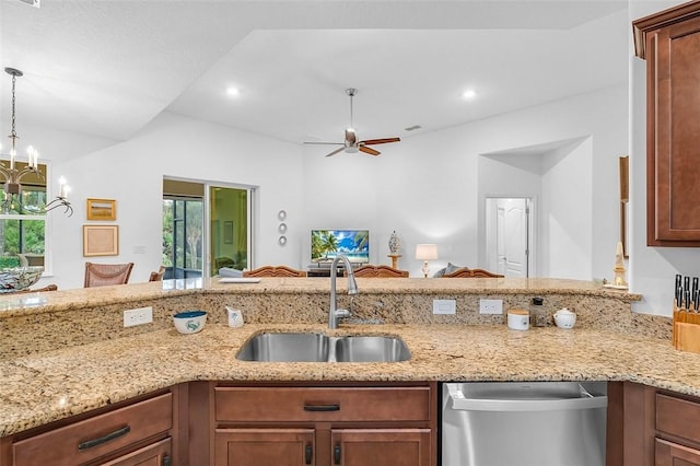 kitchen featuring ceiling fan with notable chandelier, dishwasher, sink, hanging light fixtures, and light stone counters